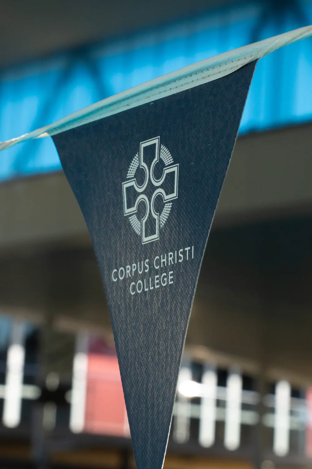 A Corpus Christi College pennant hanging above the pool deck